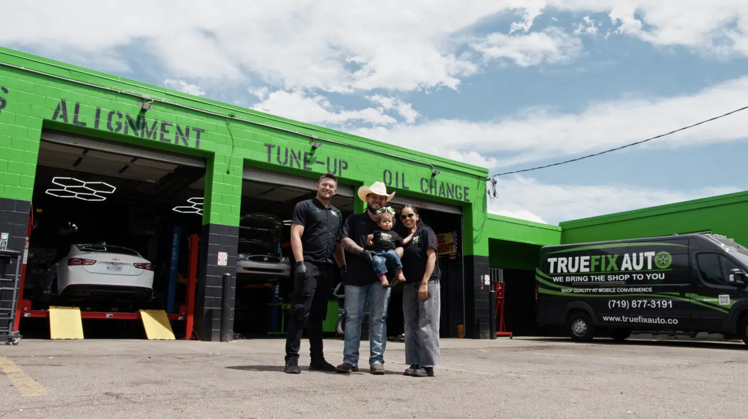 The TrueFix Auto team outside the shop